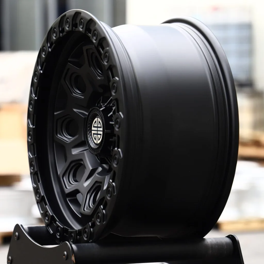 6x135 wheels – Matte Black Exposed Bolt Detail, side view