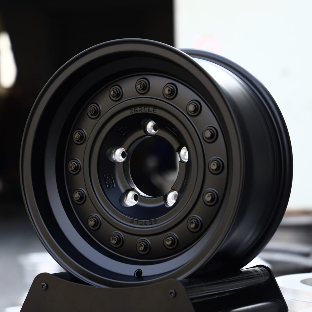 Toyota Land Cruiser wheels – Matte Black Steelie-Style (Jeep Wrangler / Land Cruiser Beadlock Off-Road Forged Wheels – Matte Black Steelie-Style), angled view