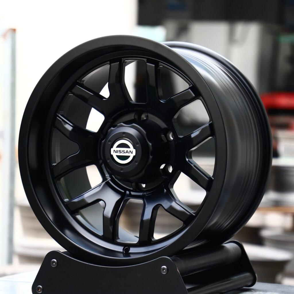 Nissan Pathfinder Armada wheels – Gloss Black 6 Y-Spoke (Nissan OEM-Style), angled view