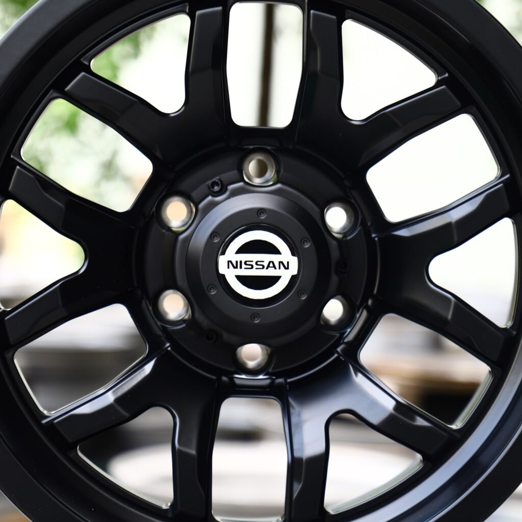 Toyota Tacoma wheels – Gloss Black 6 Y-Spoke (Nissan OEM-Style), lip and barrel detail