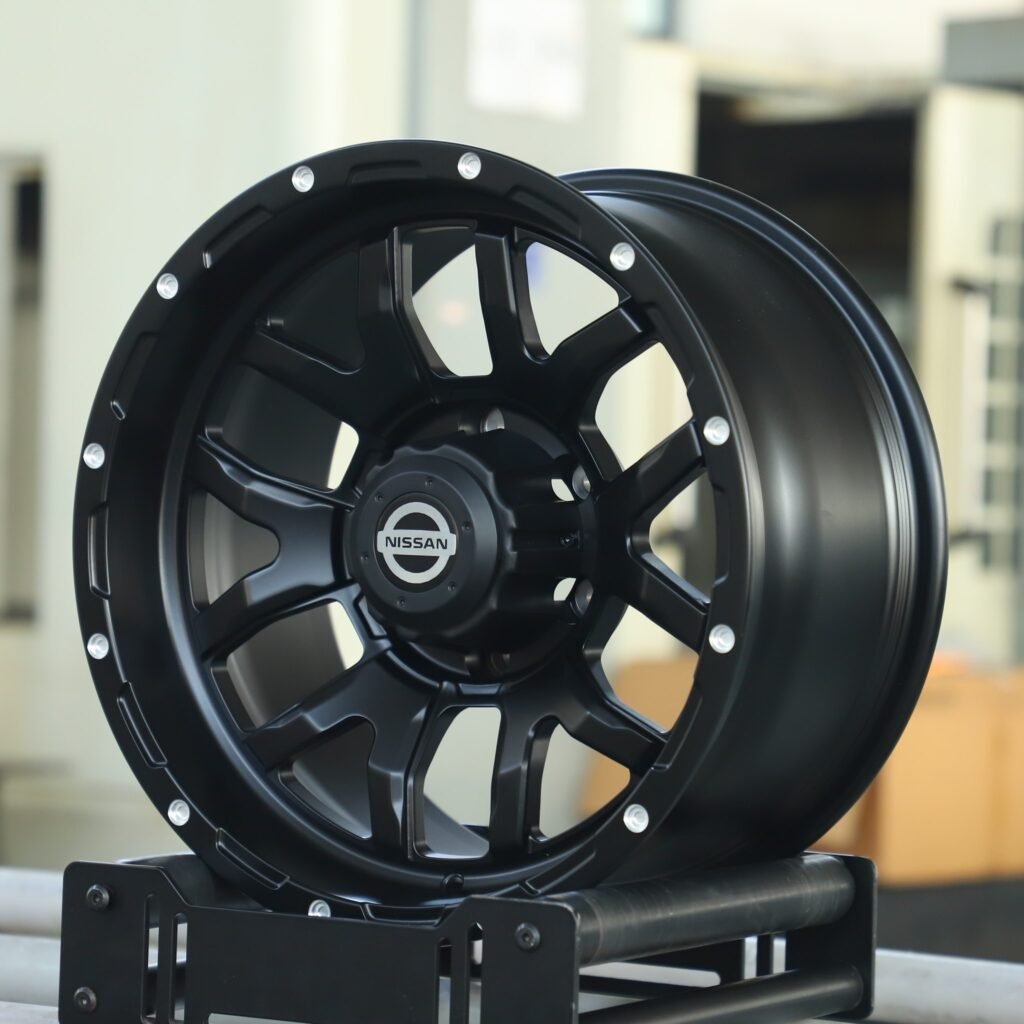 Nissan Pathfinder Armada wheels – Matte Black Exposed Bolt Detail (Nissan OEM-Style), angled view