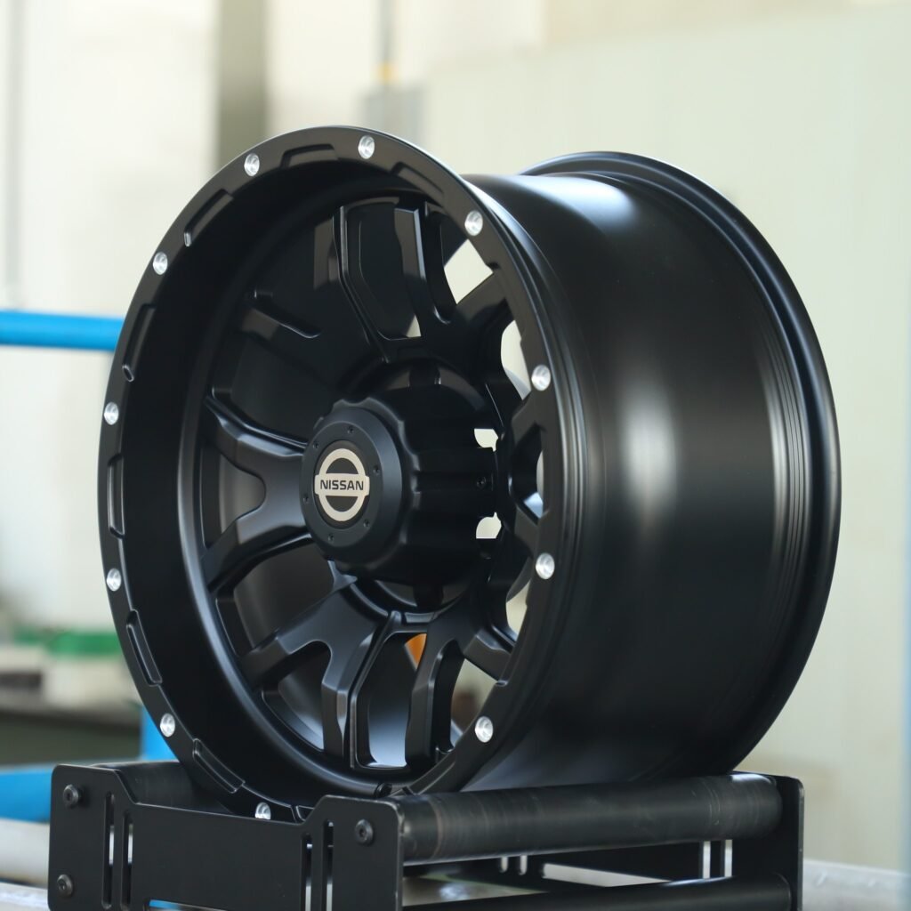 6x139.7 wheels – Matte Black Exposed Bolt Detail (Nissan OEM-Style), side view