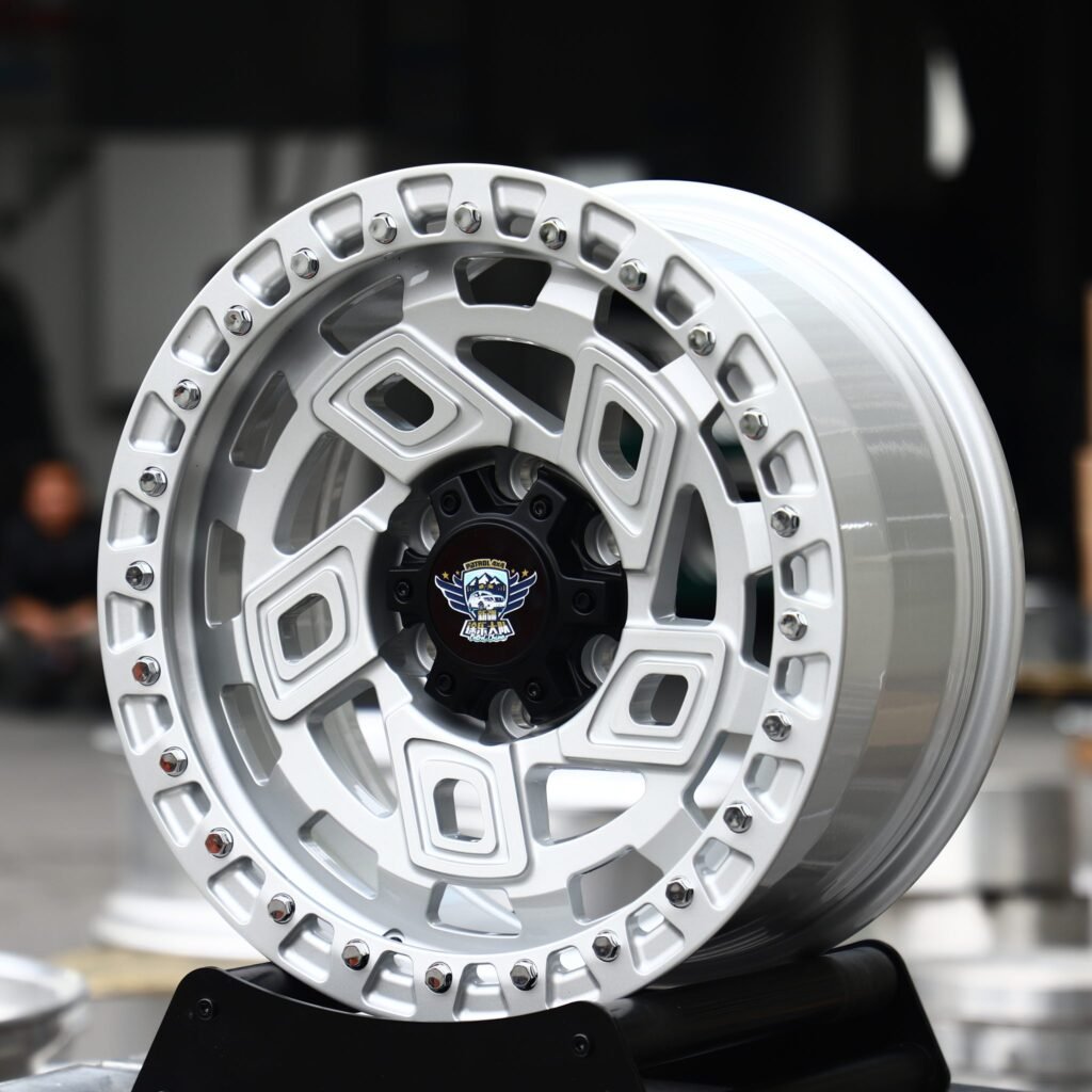 Toyota Tacoma wheels – Bright Silver Geometric Beadlock (Patrol 4×4-Style), angled view