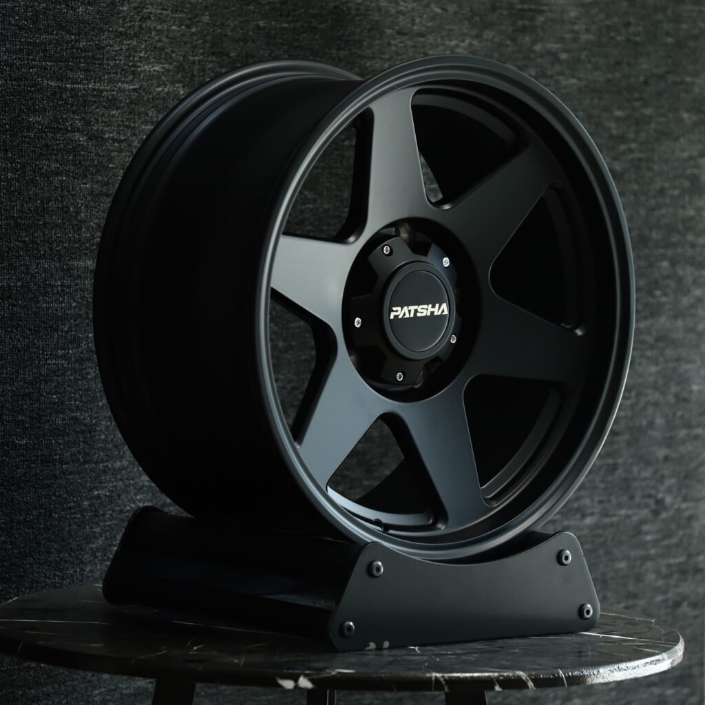 Toyota Tacoma wheels – Patsha Gloss Black 6-Spoke, angled view