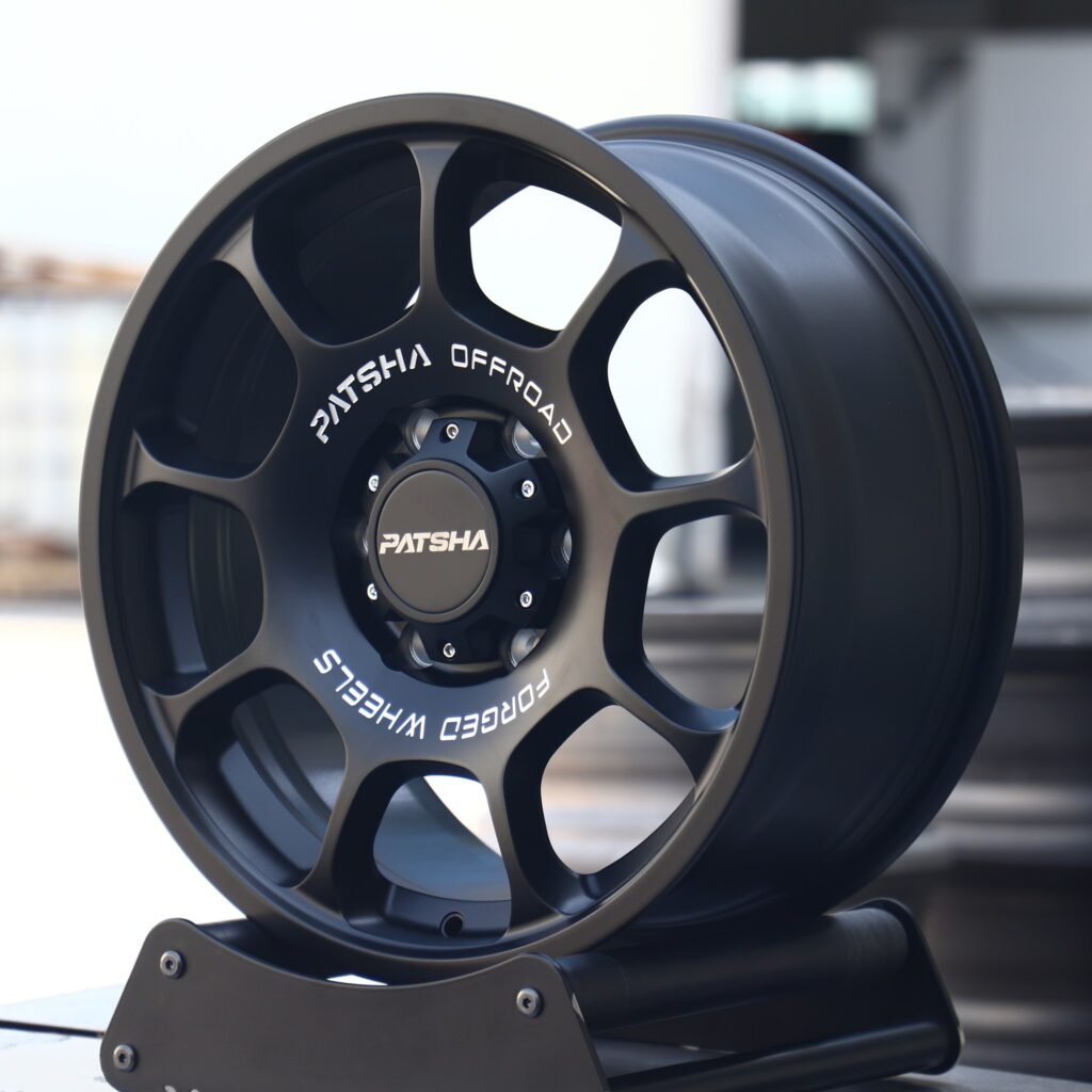 Toyota Tacoma wheels – Patsha Gloss Black Full-Face, angled view