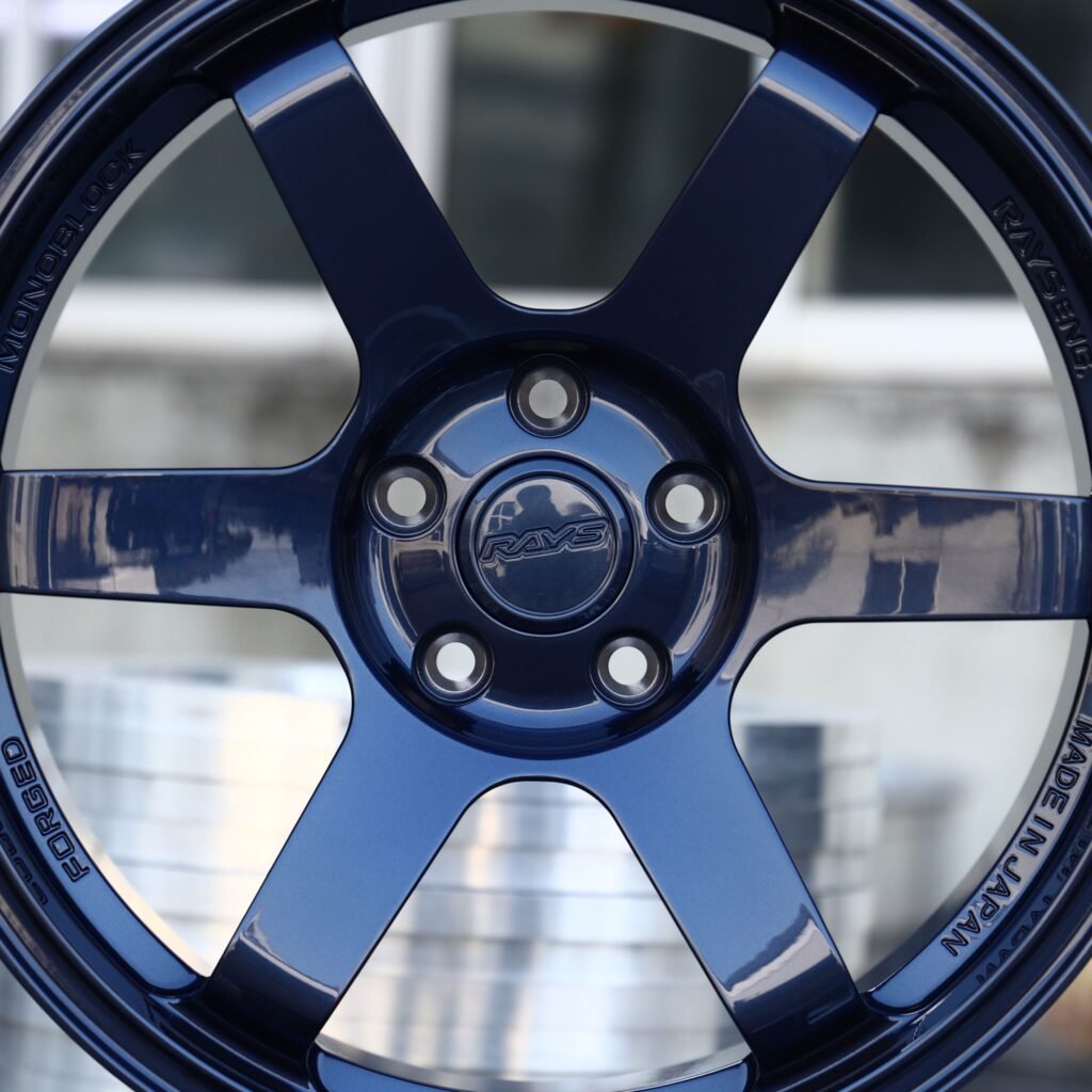 Toyota GR Supra wheels – Blue 6-Spoke (Rays-Style), lip and barrel detail