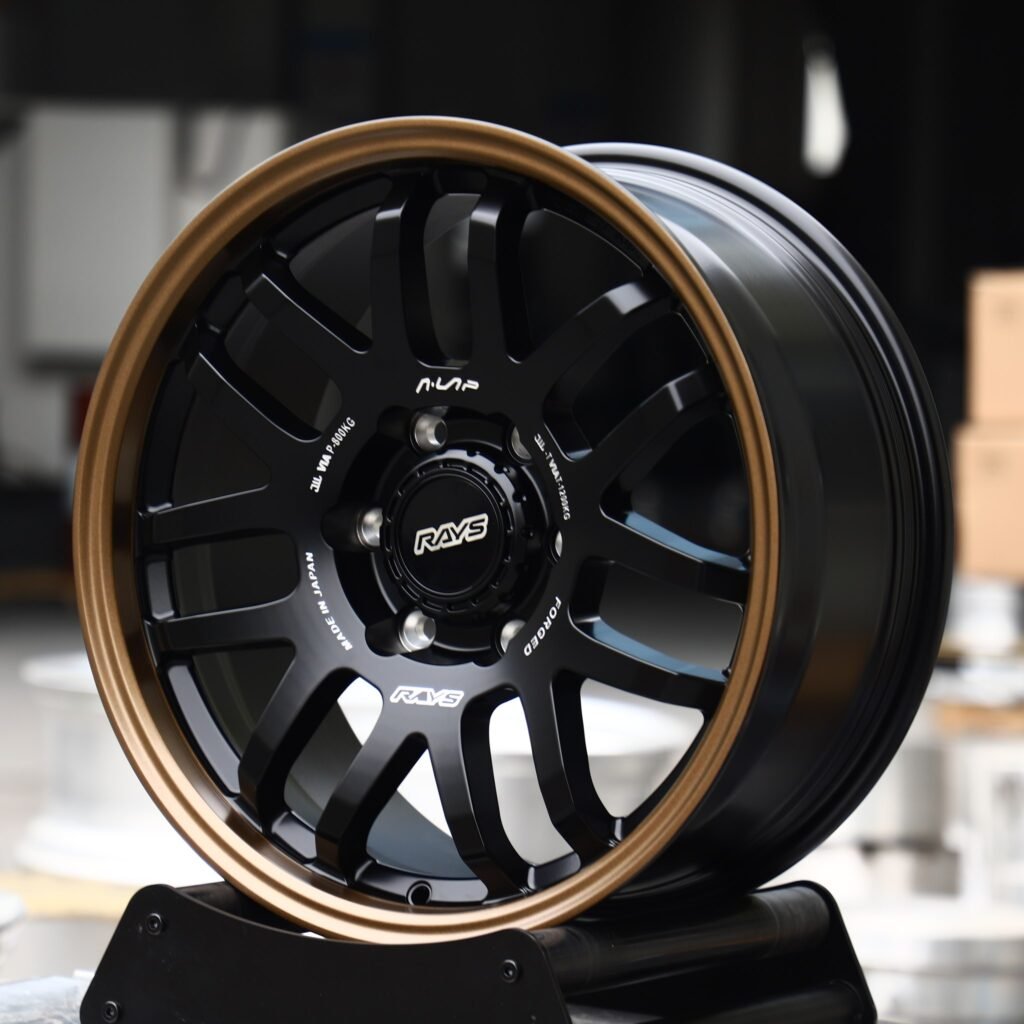Chevrolet Silverado 1500 wheels – Matte Black 12-Spoke Bronze Lip (Rays-Style), angled view