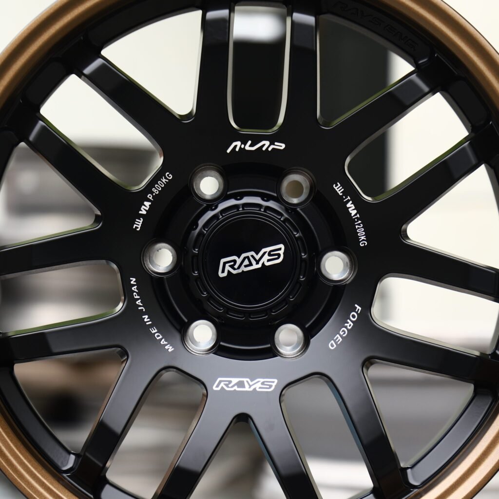 Toyota Tacoma wheels – Matte Black 12-Spoke Bronze Lip (Rays-Style), lip and barrel detail