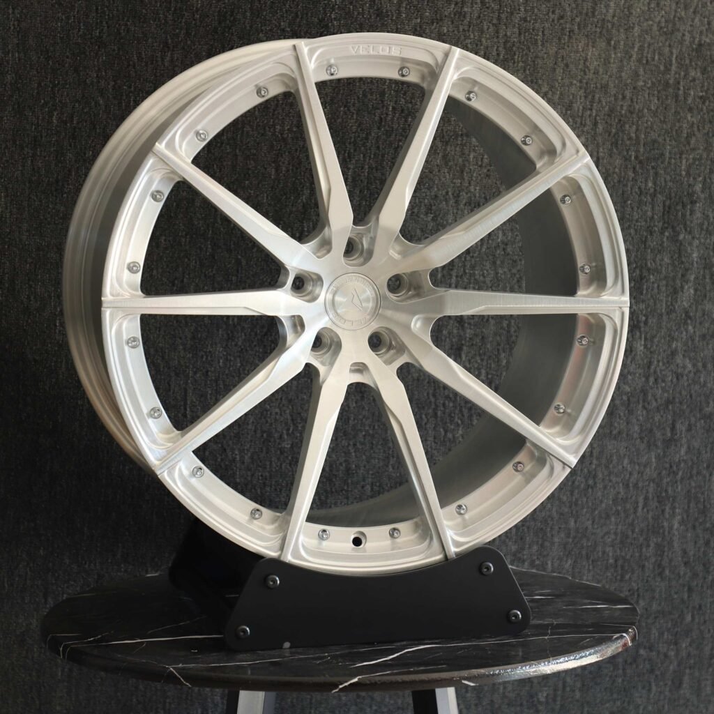Tesla Model Y wheels – Riveted Brushed Silver 10-Spoke, angled view