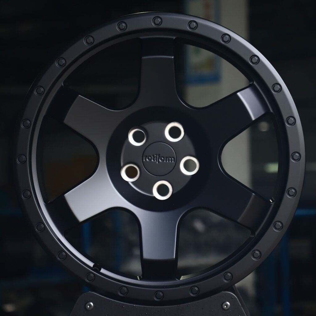 Toyota Tacoma wheels – Rotiform Gloss Black Exposed Bolt Detail, front view