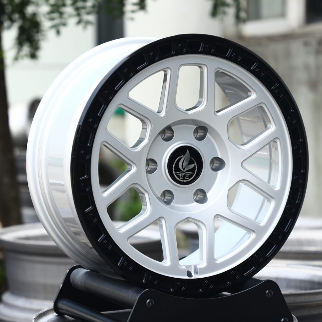 Toyota Tacoma wheels – Silver / Gloss White / Gloss Black Exposed Bolt Detail, angled view