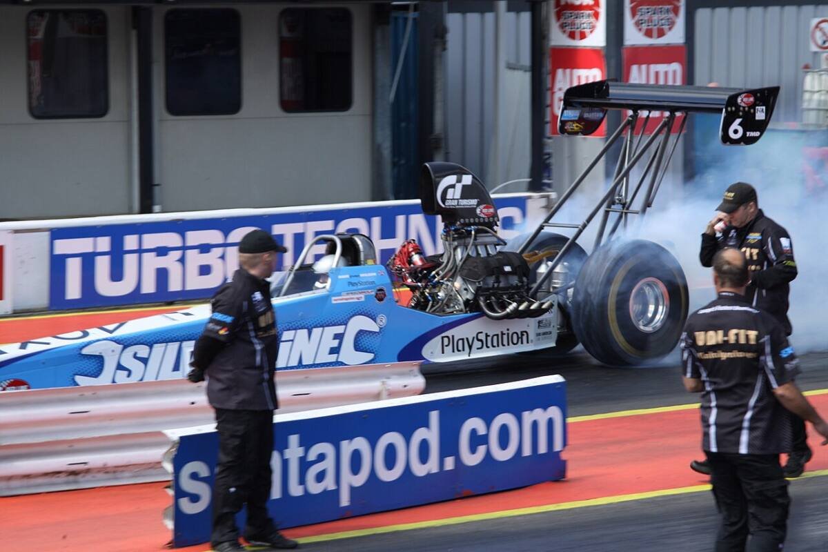Top Fuel dragster pre-race burnout, a class where beadlock drag wheels are mandatory