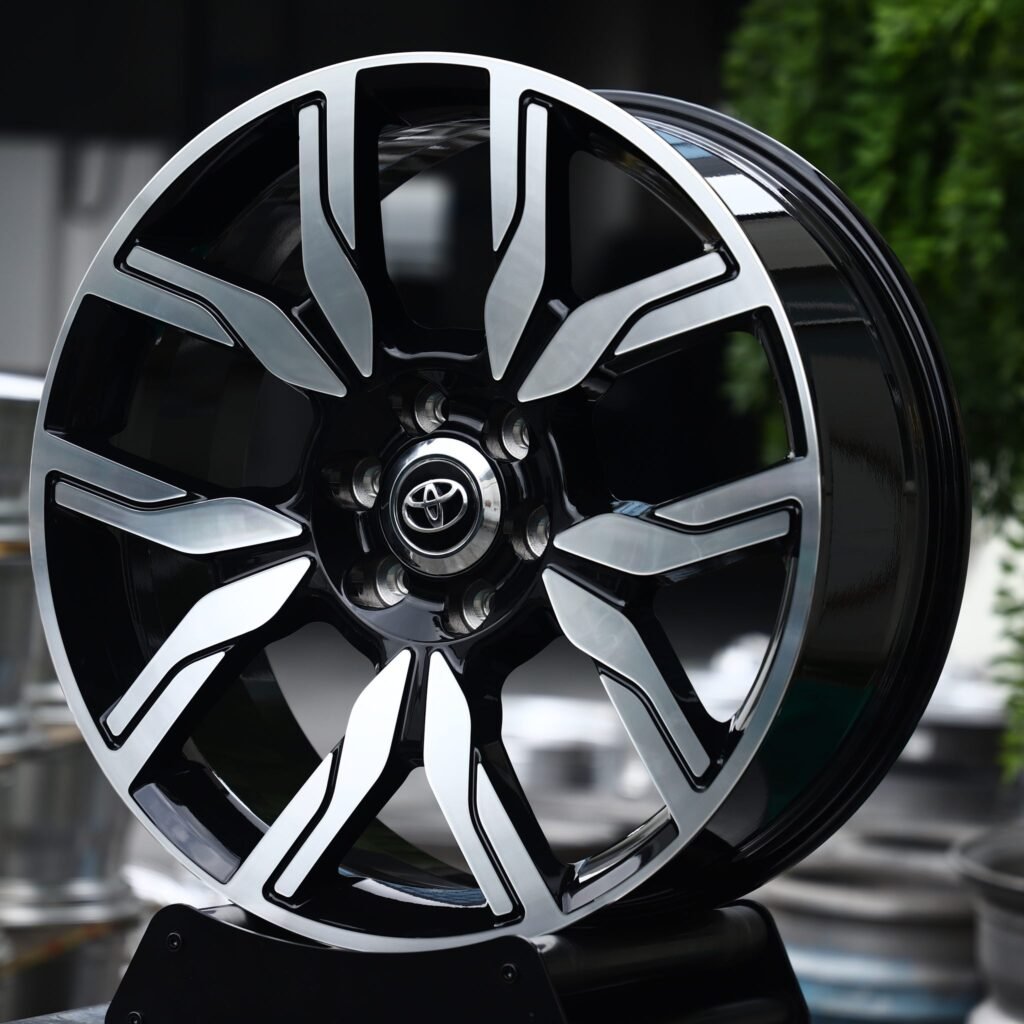 Toyota Land Cruiser wheels – Gloss Black / Machined 5 Split-Spoke (Toyota OEM-Style), angled view