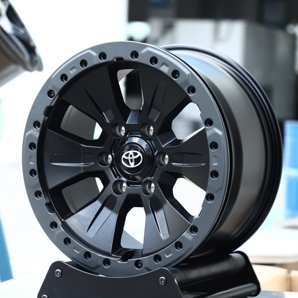 Toyota Tacoma wheels – Gloss Black / Gray, angled view