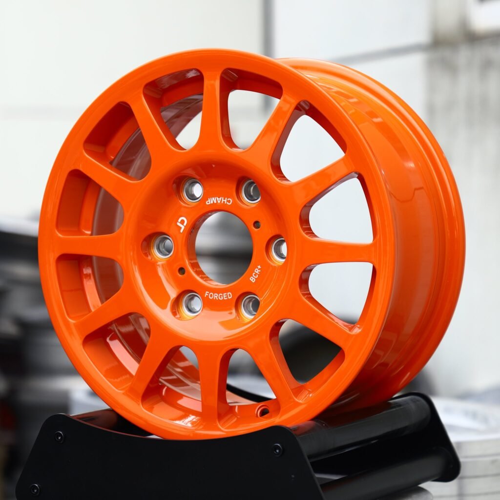 6x139.7 wheels – Orange 12-Spoke, side view