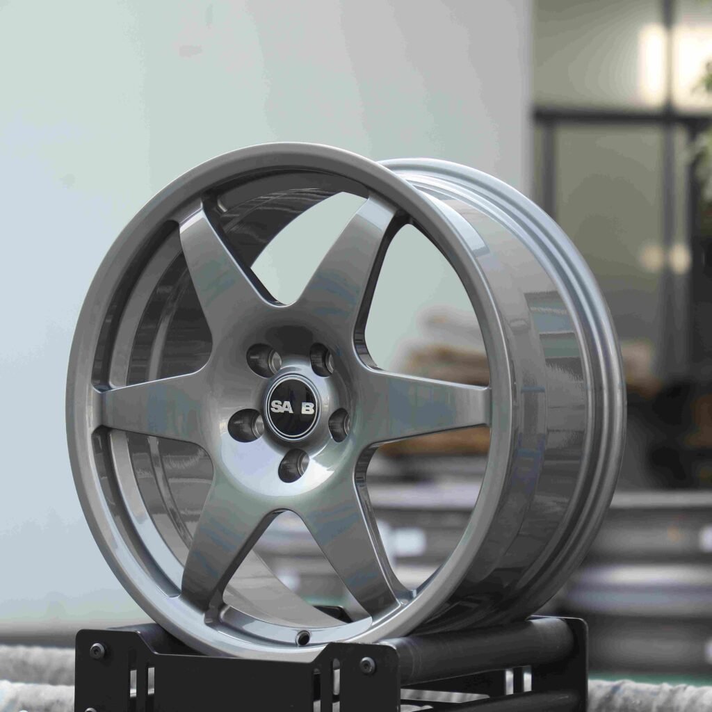Saab 9-5 wheels – Transparent Gray 6-Spoke Side-Milled (Saab OEM-Style), angled view