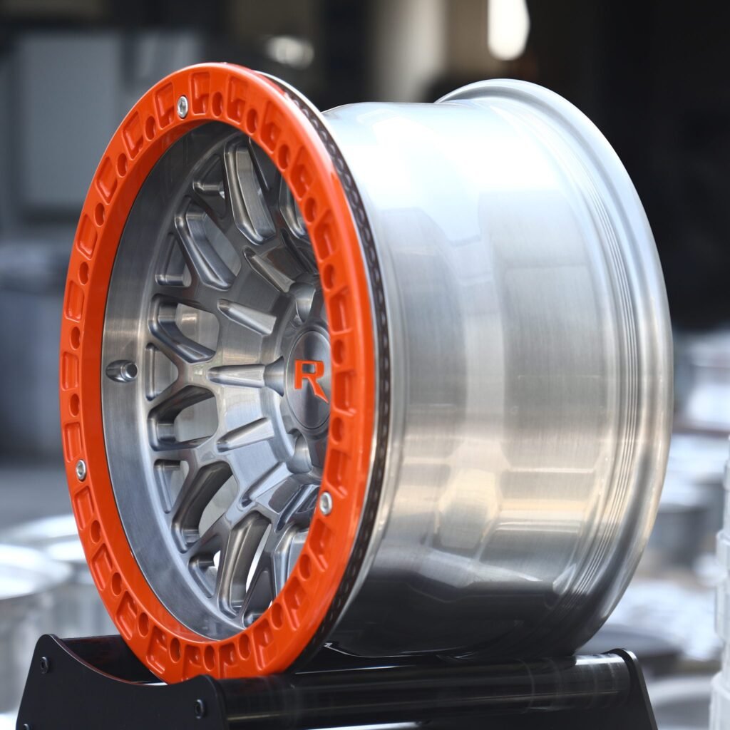 Toyota Land Cruiser wheels – Transparent Orange / Brushed Mesh, angled view