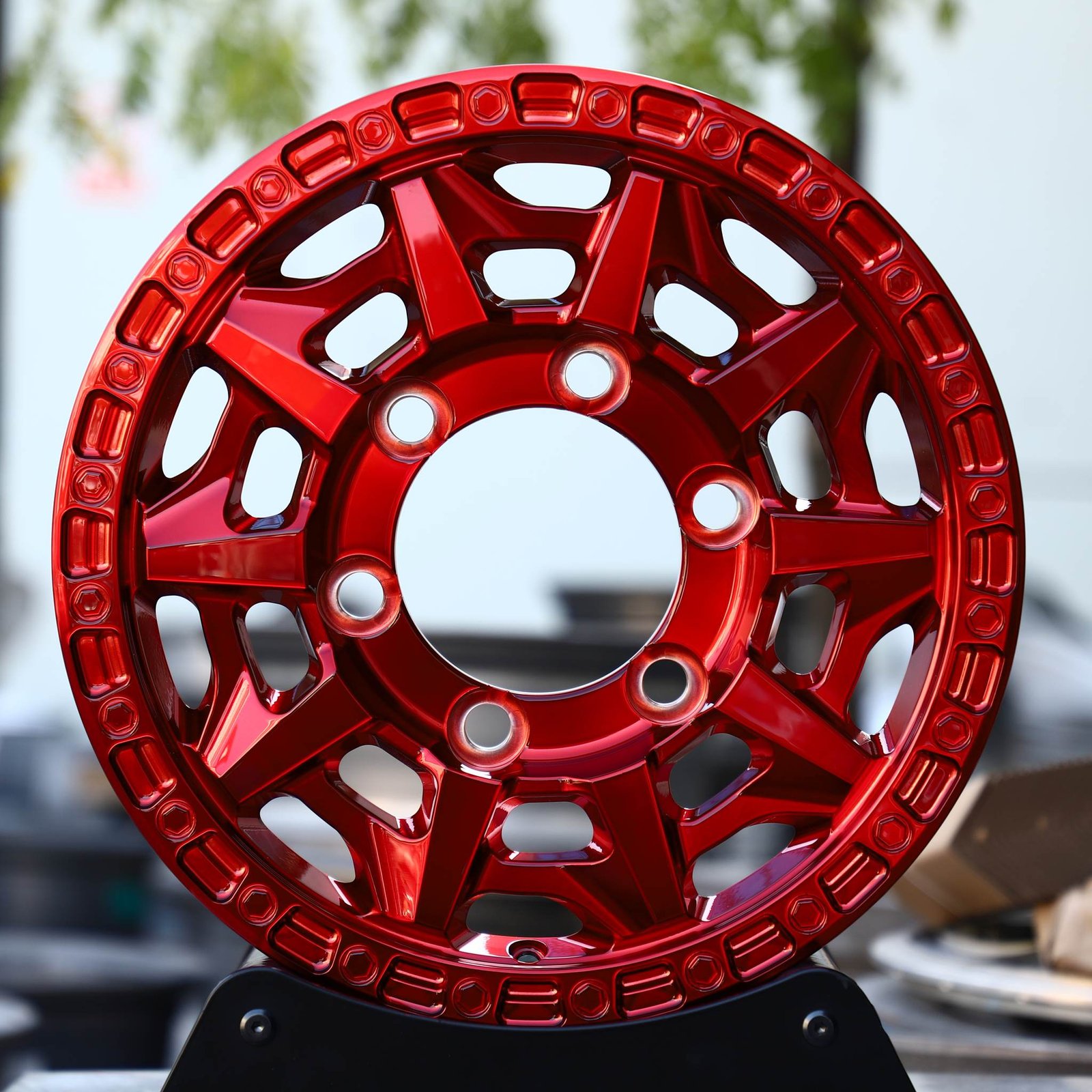 Toyota Tacoma wheels – Transparent Red Double-Ring Exposed Bolt Detail, front view