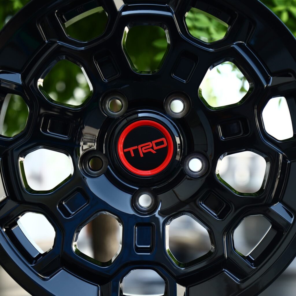 6x139.7 wheels – Gloss Black Hex-Window (TRD-Style), side view