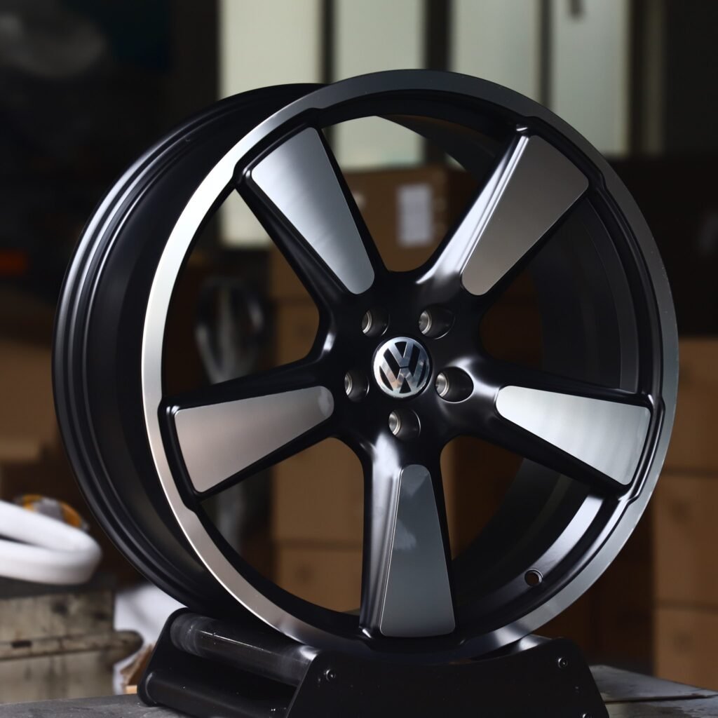 Volkswagen Tiguan wheels – Black / Machined Curved 5-Spoke (Volkswagen OEM-Style), angled view