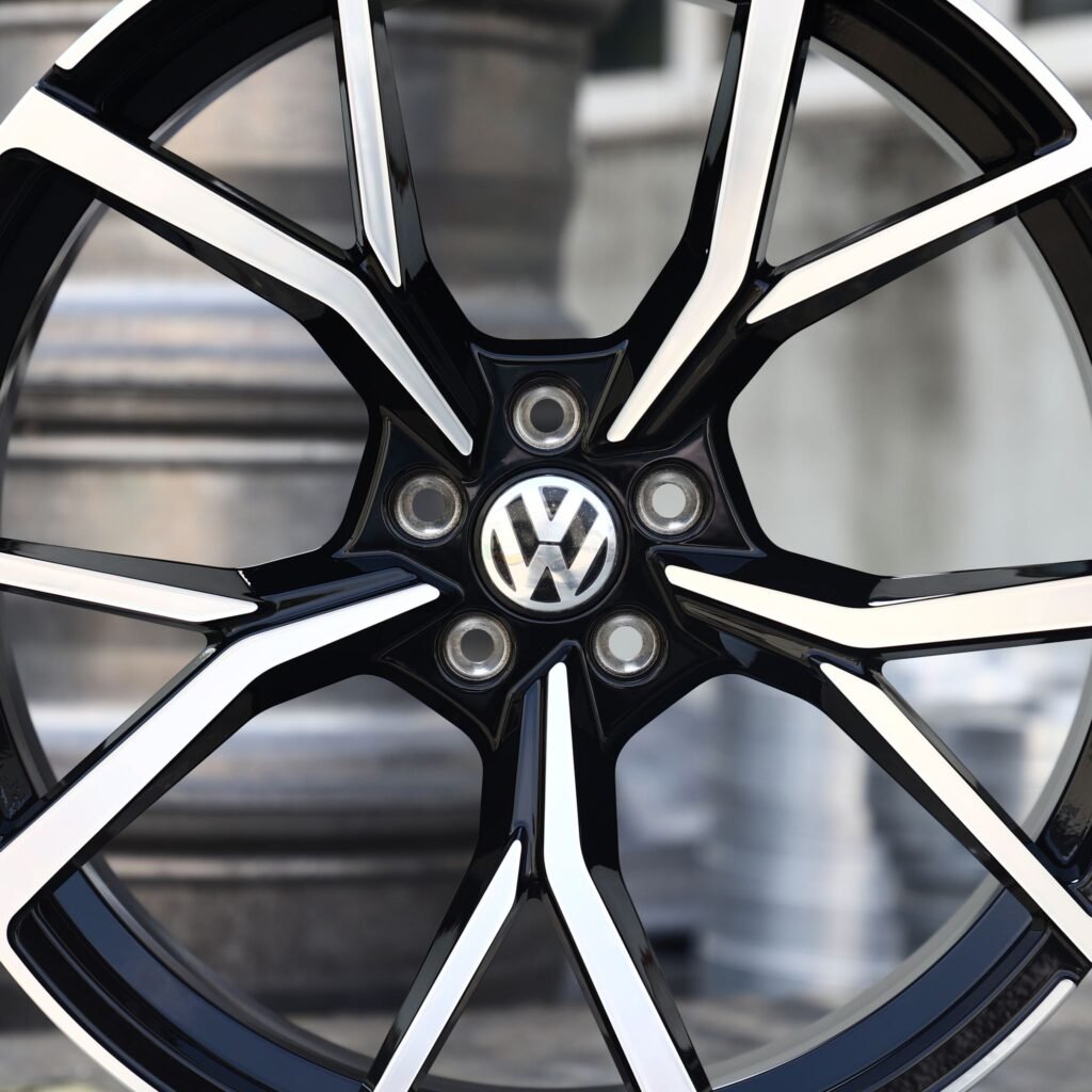 Volkswagen Tiguan wheels – Black / Machined 5 Twin-Spoke (Volkswagen OEM-Style), angled view