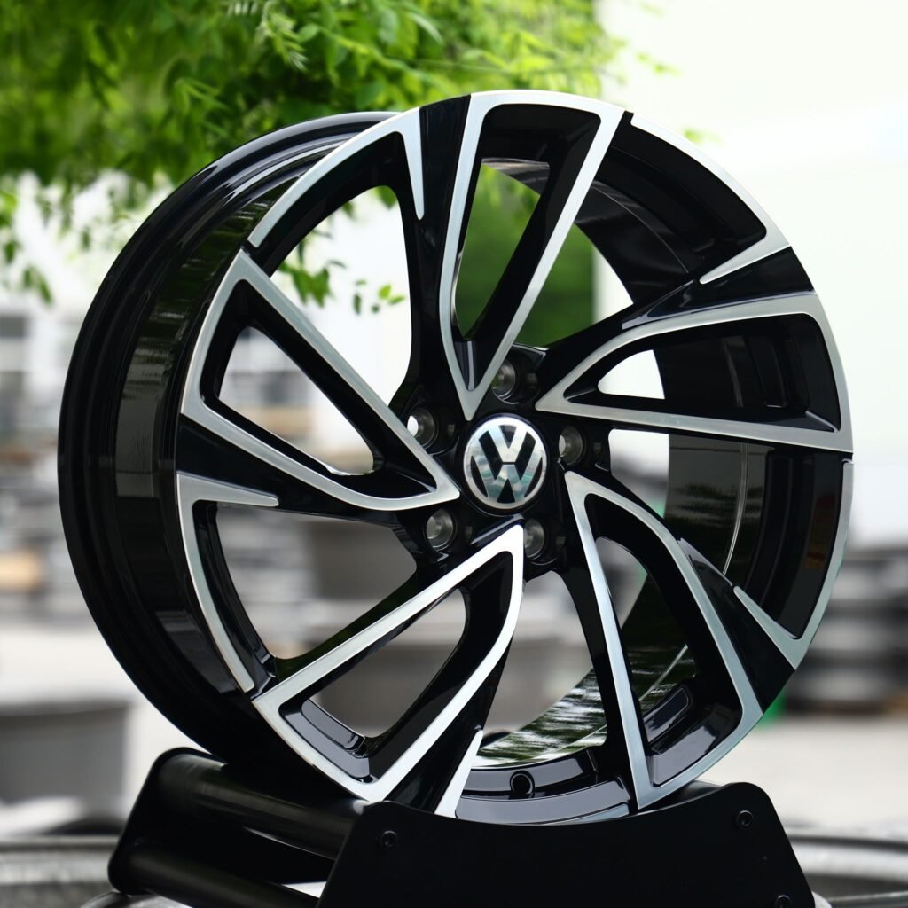Volkswagen Tiguan wheels – Gloss Black Machined Directional (Volkswagen OEM-Style), angled view