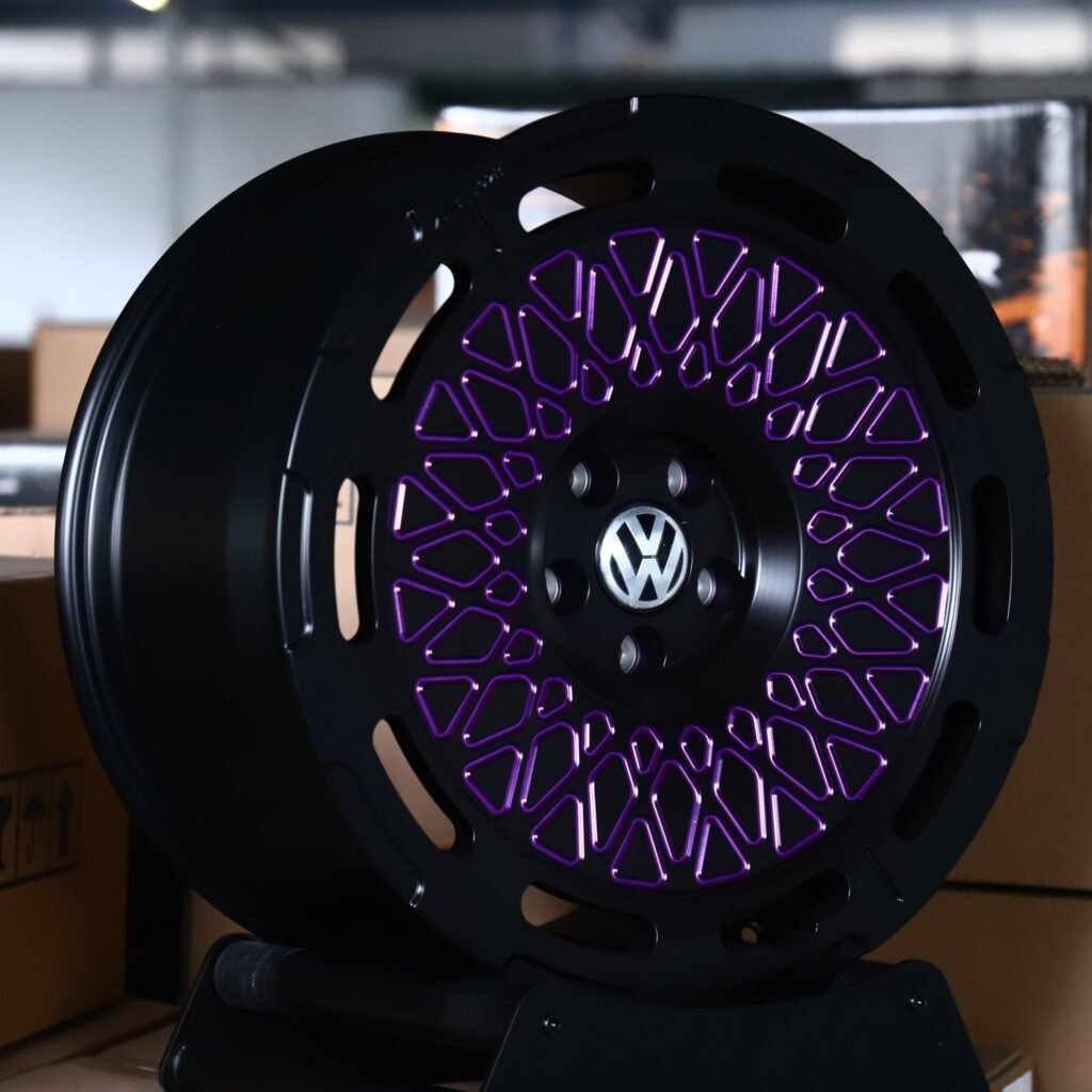 Volkswagen Tiguan wheels – Matte Black / Purple Lattice Mesh (Volkswagen OEM-Style), angled view