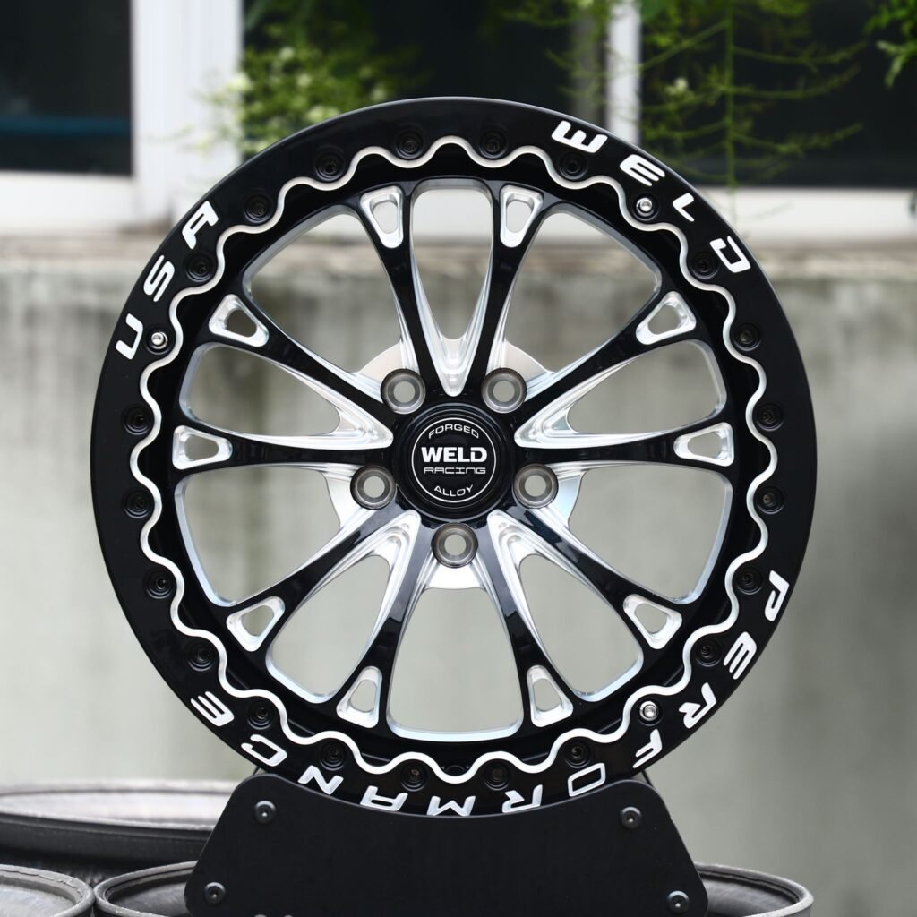 Toyota Tacoma wheels – Weld Gloss Black Racing 10-Spoke, front view