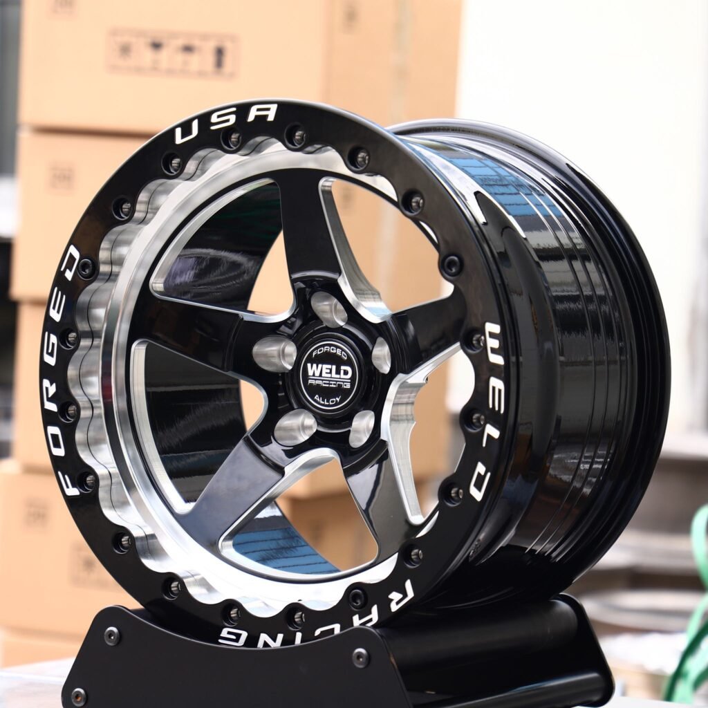 Chevrolet Camaro wheels – Matte Silver Custom Beadlock (Weld Racing S71-Style), angled view