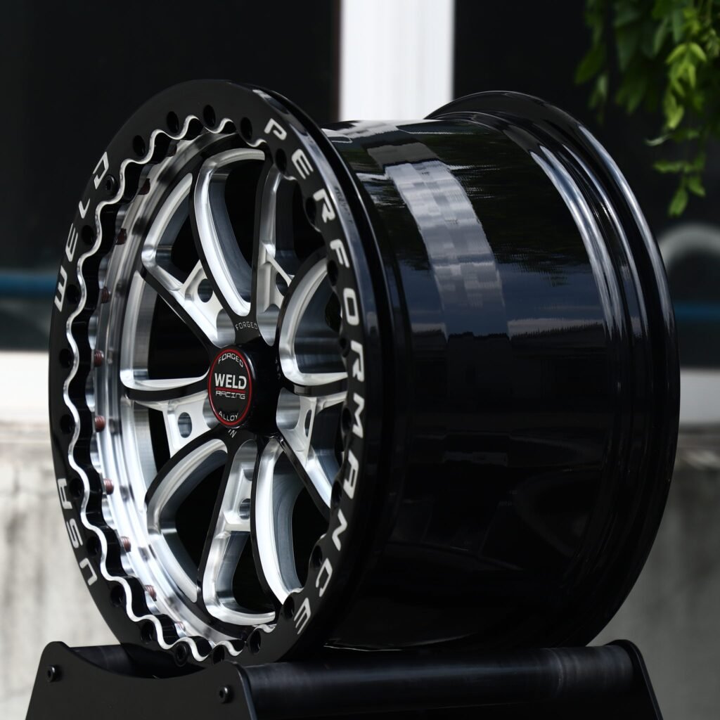 5x114.3 wheels – Gloss Black Machined 10-Spoke Beadlock (Weld Racing-Style), side view