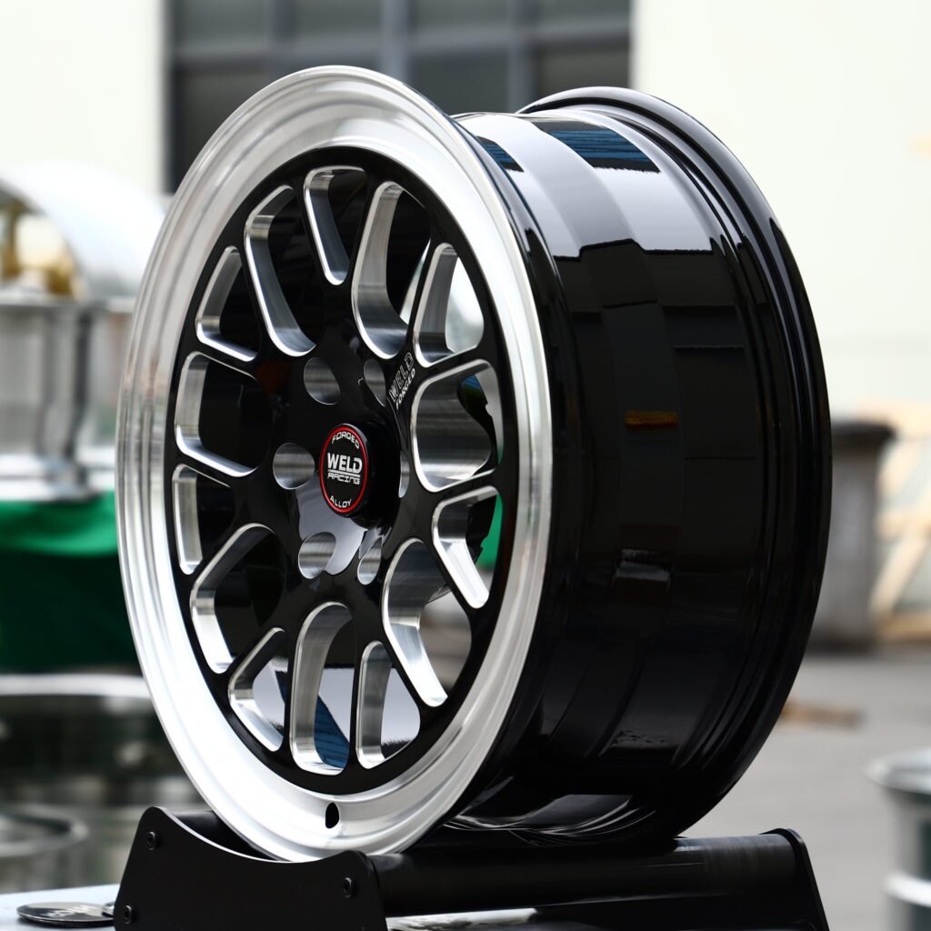 6x139.7 wheels – Gloss Black Milled 12-Spoke Polished Lip (Weld Racing-Style), side view