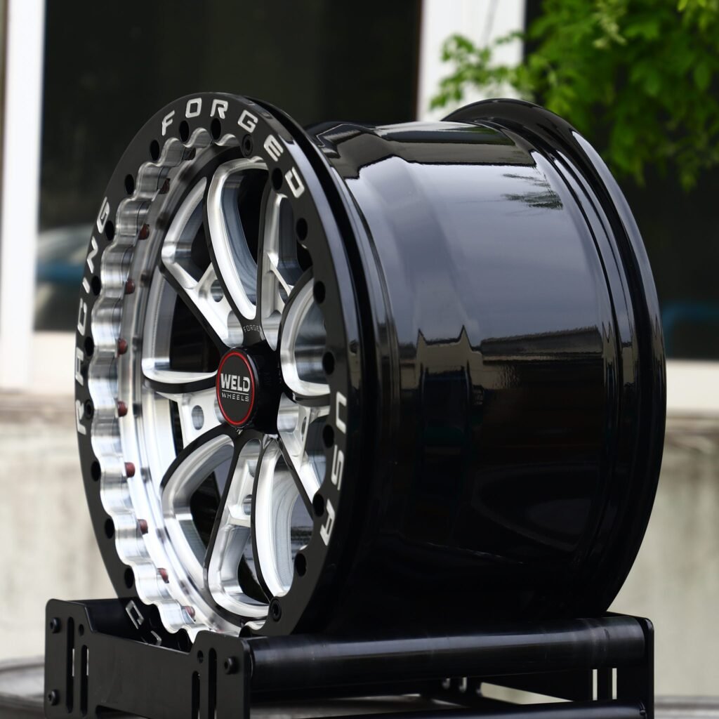 5x114.3 wheels – Gloss Black / Mirror Milled 10-Spoke Beadlock (Weld Racing-Style), side view