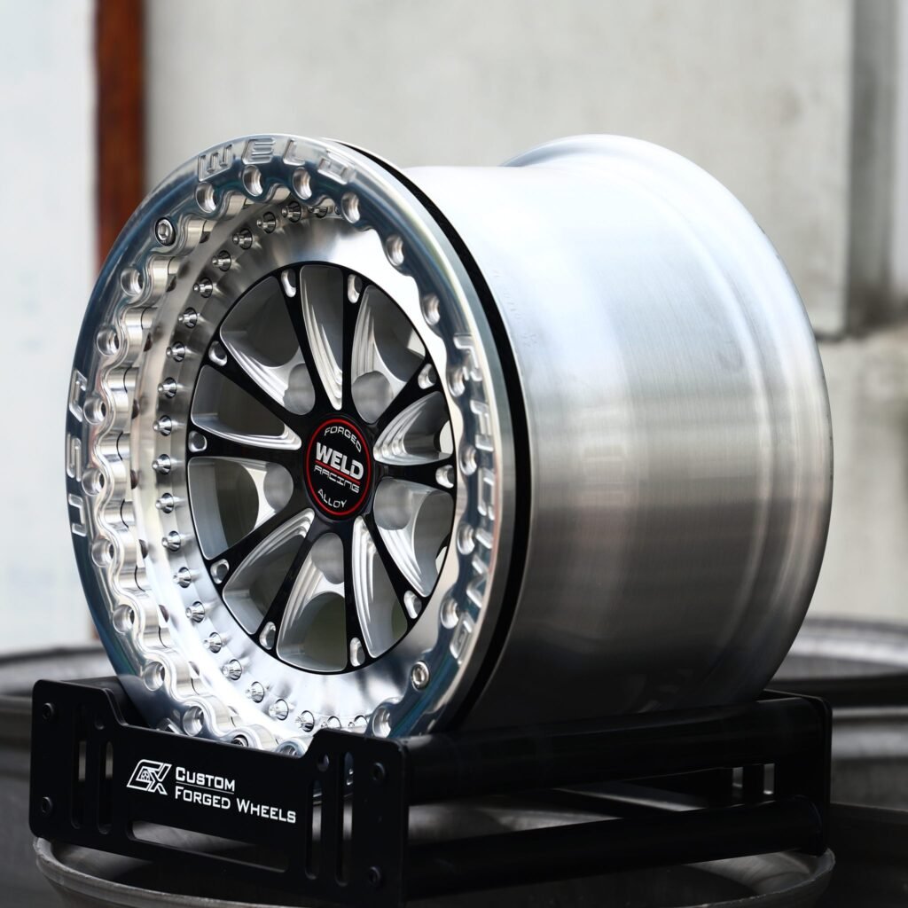 5x114.3 wheels – Mirror Milled / Black 10-Spoke Beadlock (Weld Racing-Style), side view