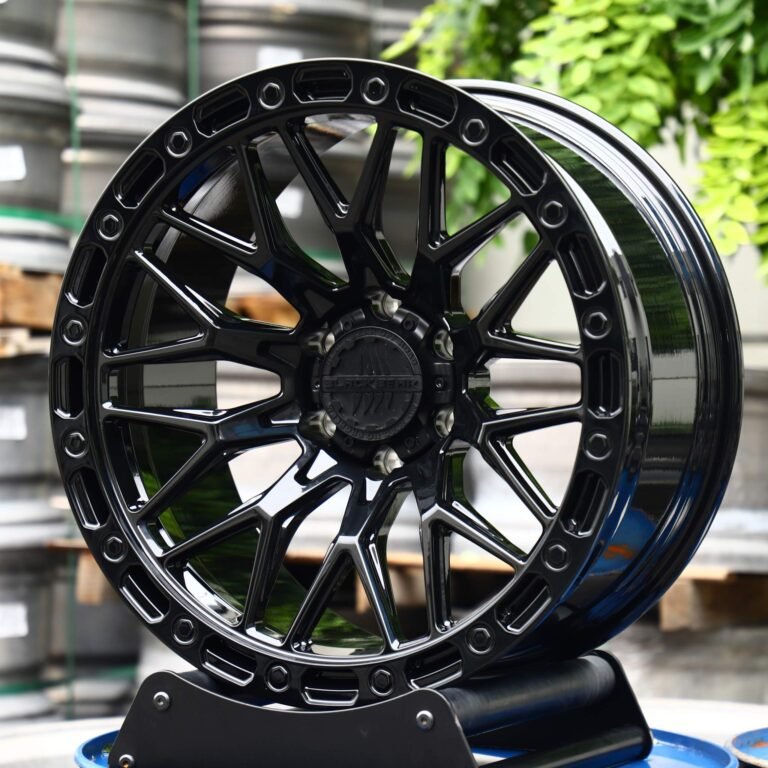 Toyota 4Runner wheels – XM XM-704 Gloss Black Multi-Spoke Faux Beadlock, front view