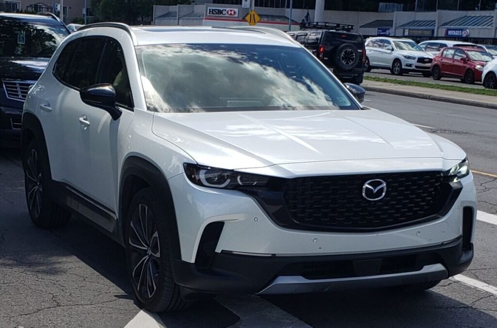 Mazda wheel interchange: 2023 Mazda CX-50 in white, front three-quarter view with factory alloy wheels