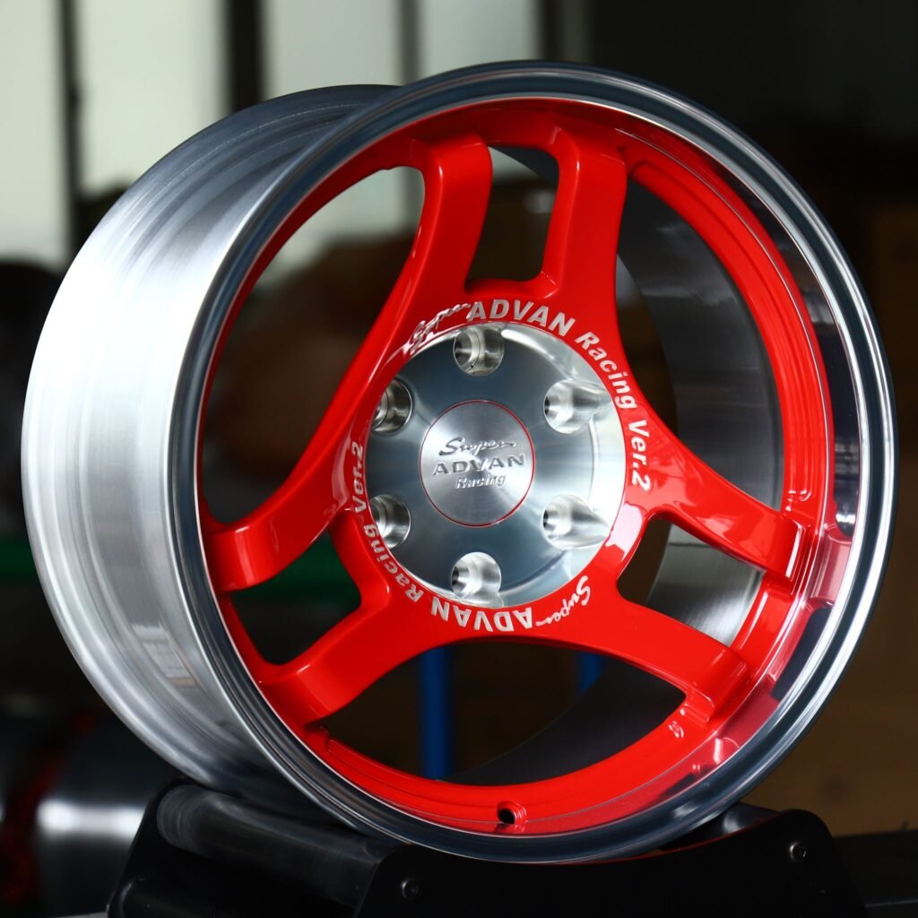 Toyota Tacoma wheels – Red 3-Spoke Polished Lip (Advan-Style), angled view