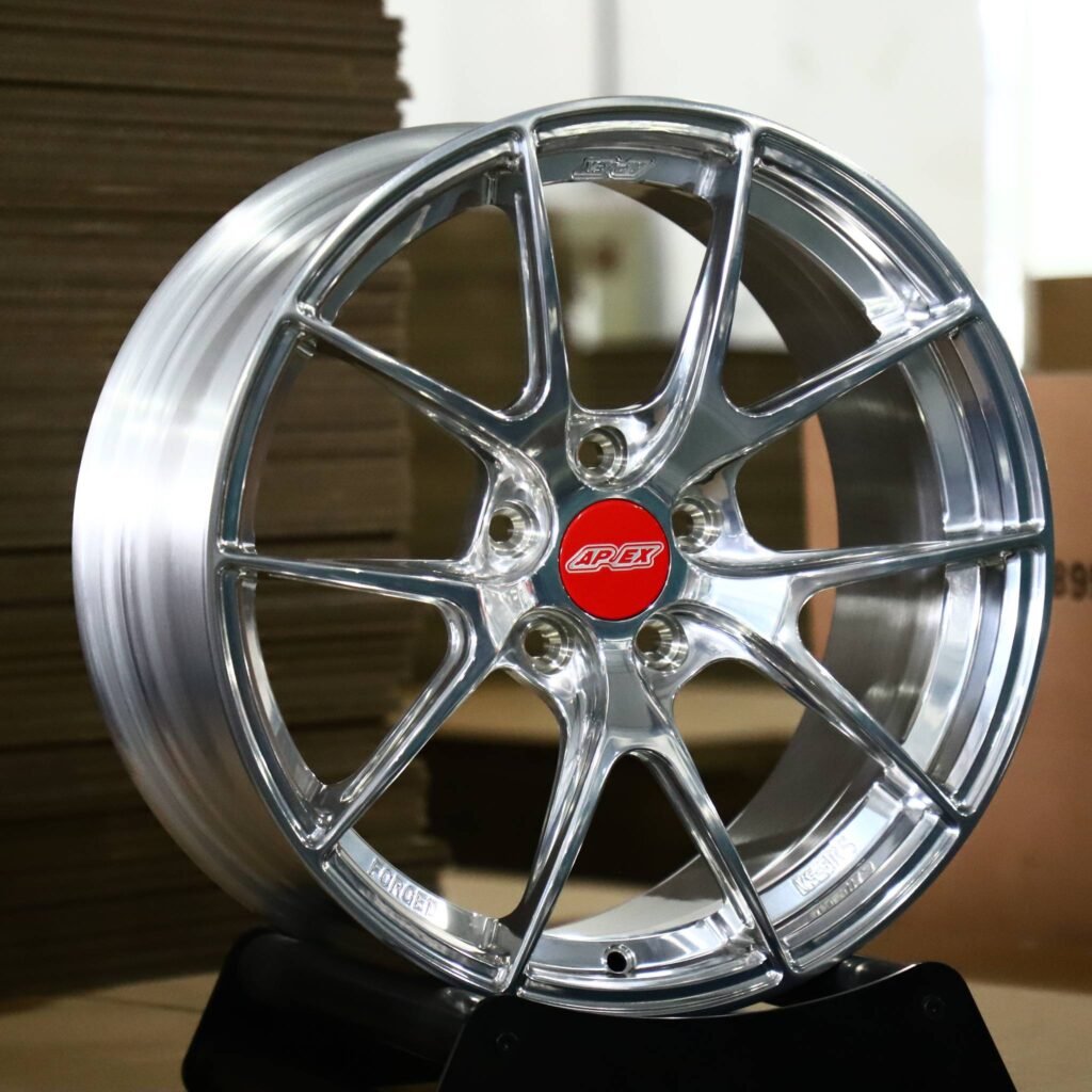 Tesla Model Y wheels – Polished 10-Spoke Red Cap (APEX-Style), angled view