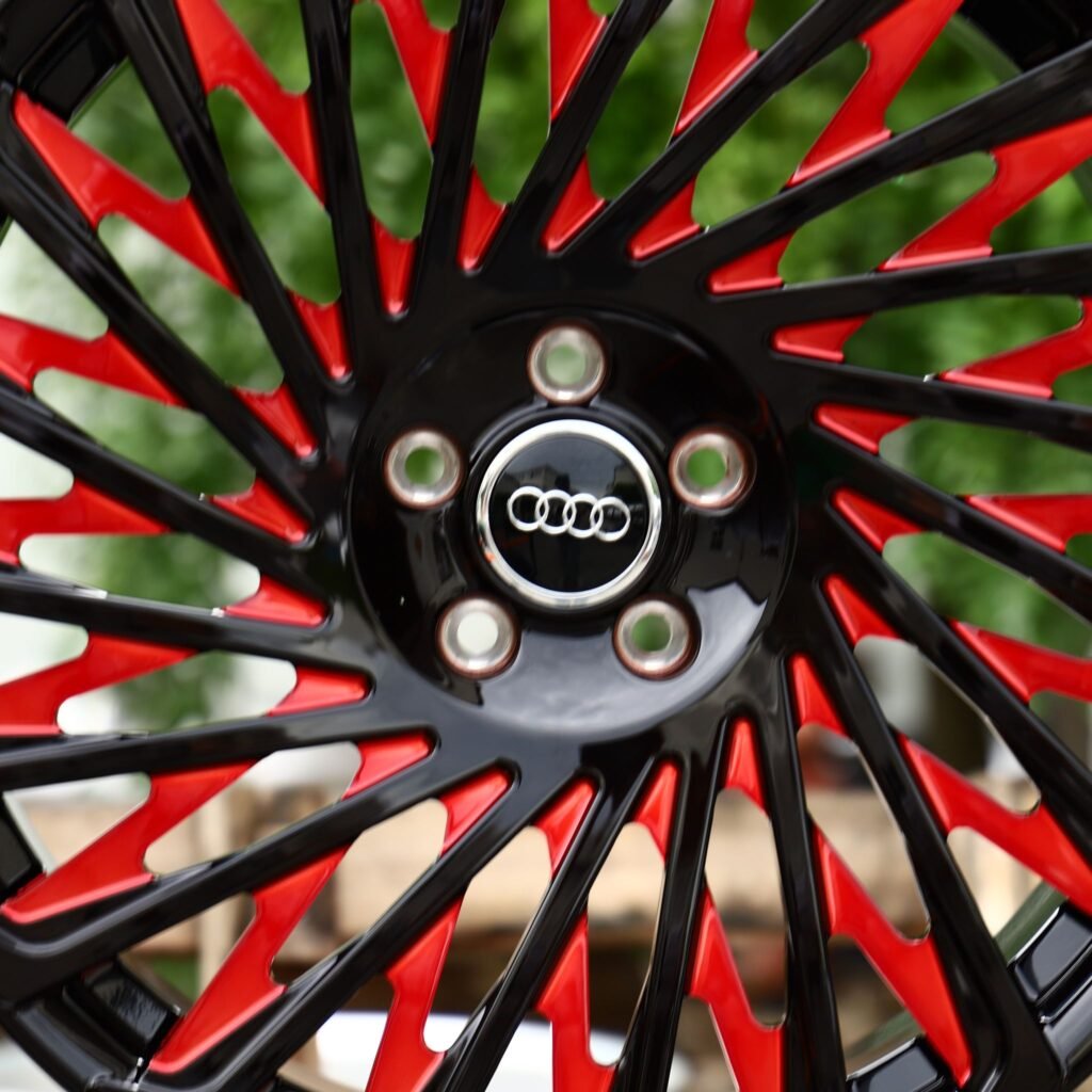 Audi A4 B9 wheels – Gloss Black / Red Swirl Multi-Spoke (Audi OEM-Style), lip and barrel detail