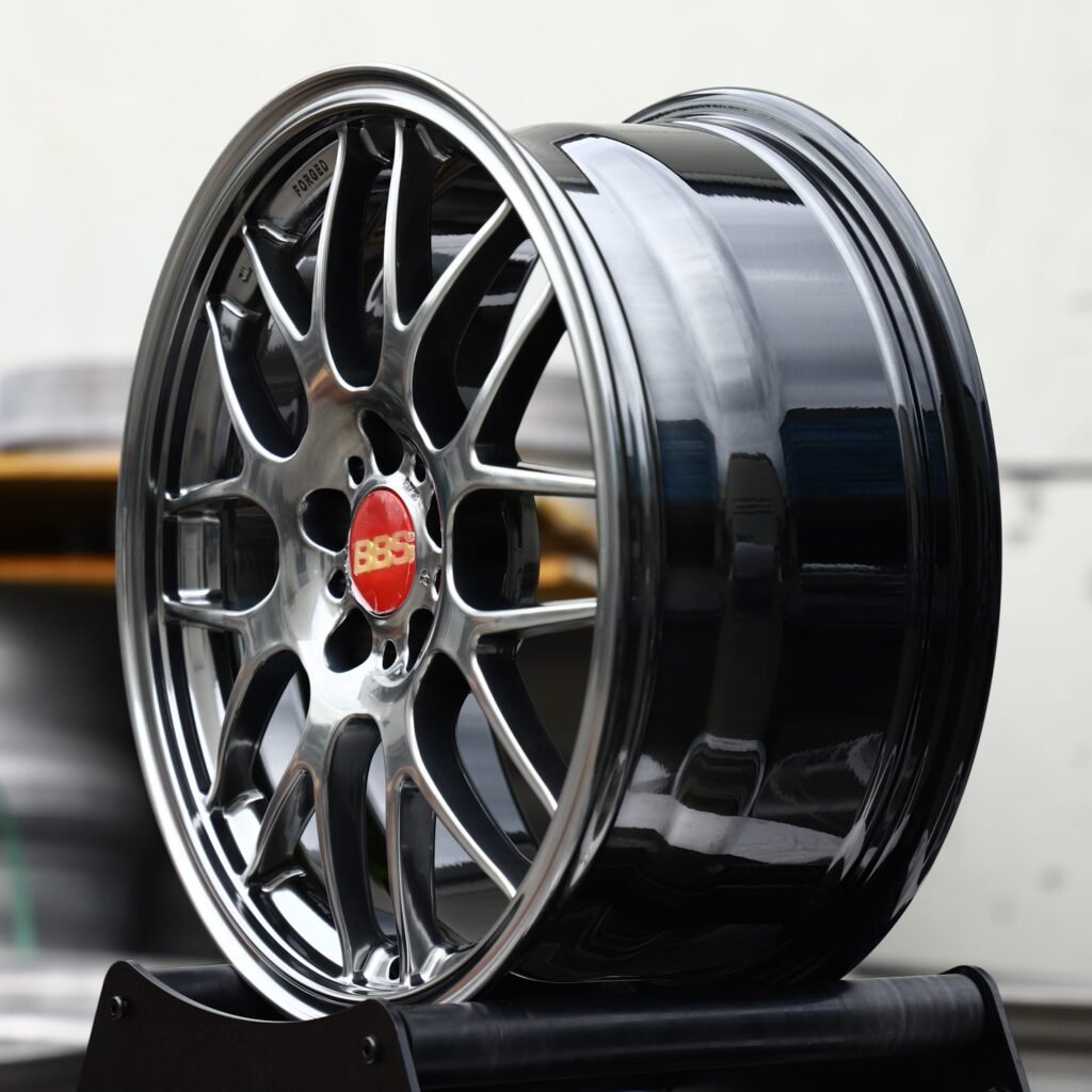5x114.3 wheels – Metallic Gray Cross-Spoke Mesh Stepped Lip (BBS-Style), side view