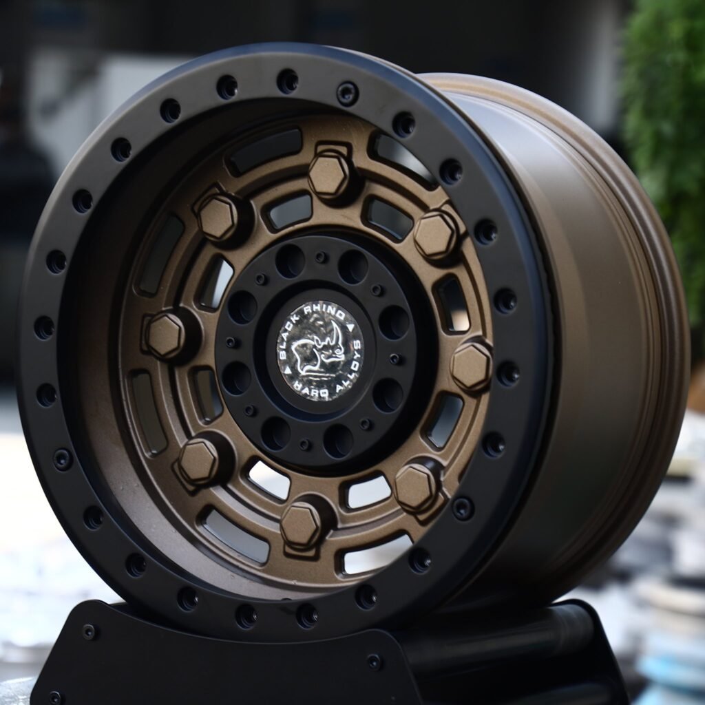 Lexus GX wheels – Matte Bronze Slotted Black-Ring Beadlock (Black Rhino-Style), angled view