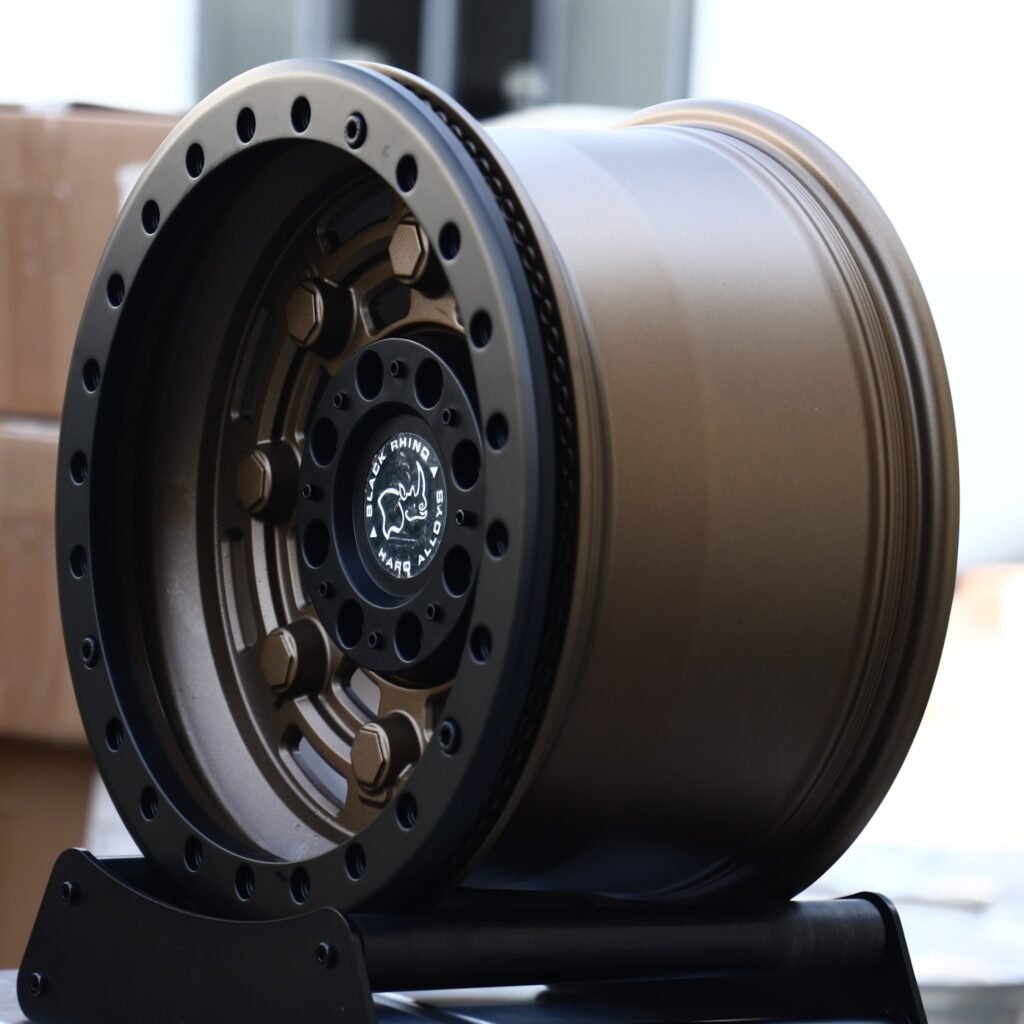 6x139.7 wheels – Matte Bronze Slotted Black-Ring Beadlock (Black Rhino-Style), side view