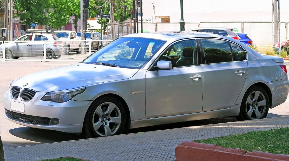 BMW 5 Series E60 530i sedan on factory alloy wheels, front three-quarter view