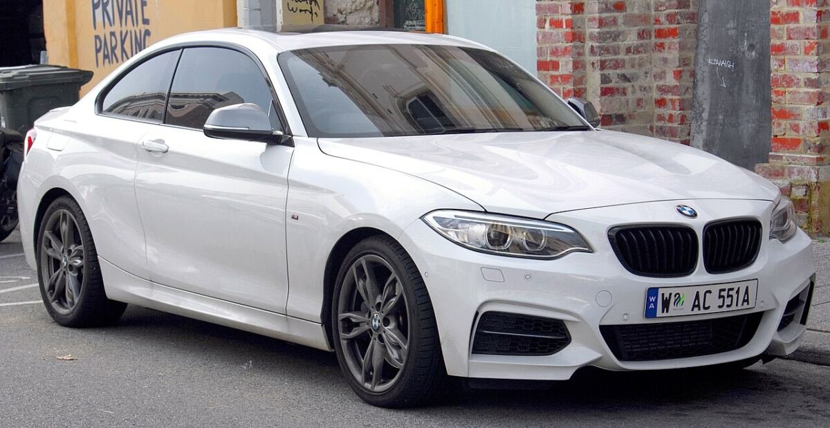 BMW M235i coupe (F22) with factory alloy wheels, front three-quarter view