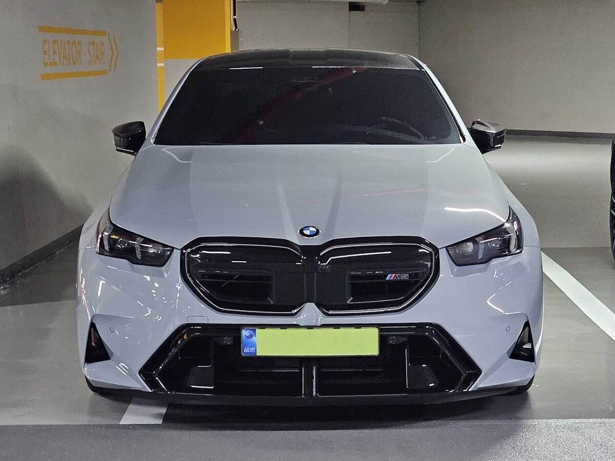 Grey BMW G90 M5 parked nose-in, the first M5 with a 5x132 bolt pattern