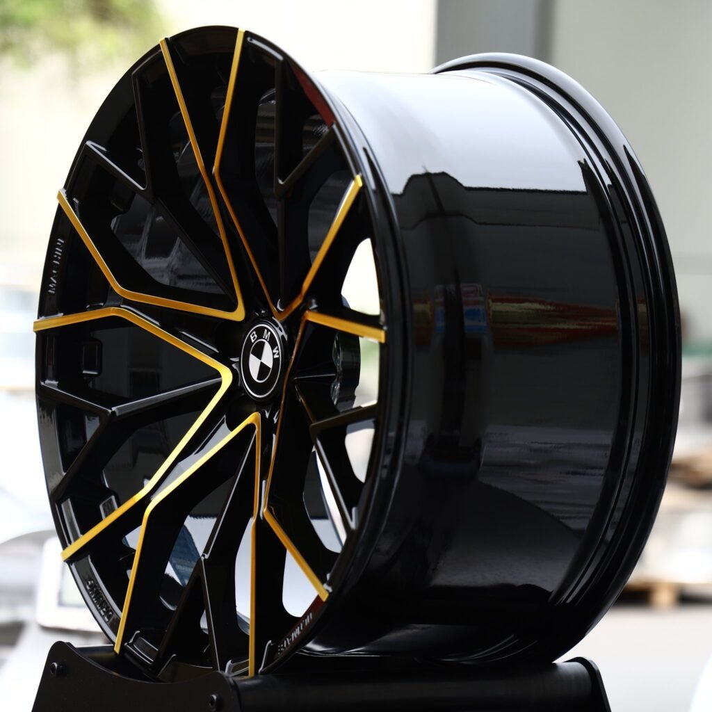 BMW M5 wheels – Gloss Black / Gold-Milled Y-Spoke Mesh (BMW OEM-Style), angled view