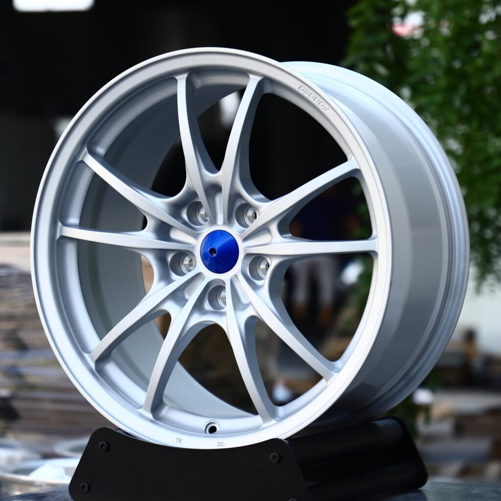 Audi Q7 wheels – Matte Silver 10-Spoke Blue Cone Cap, angled view