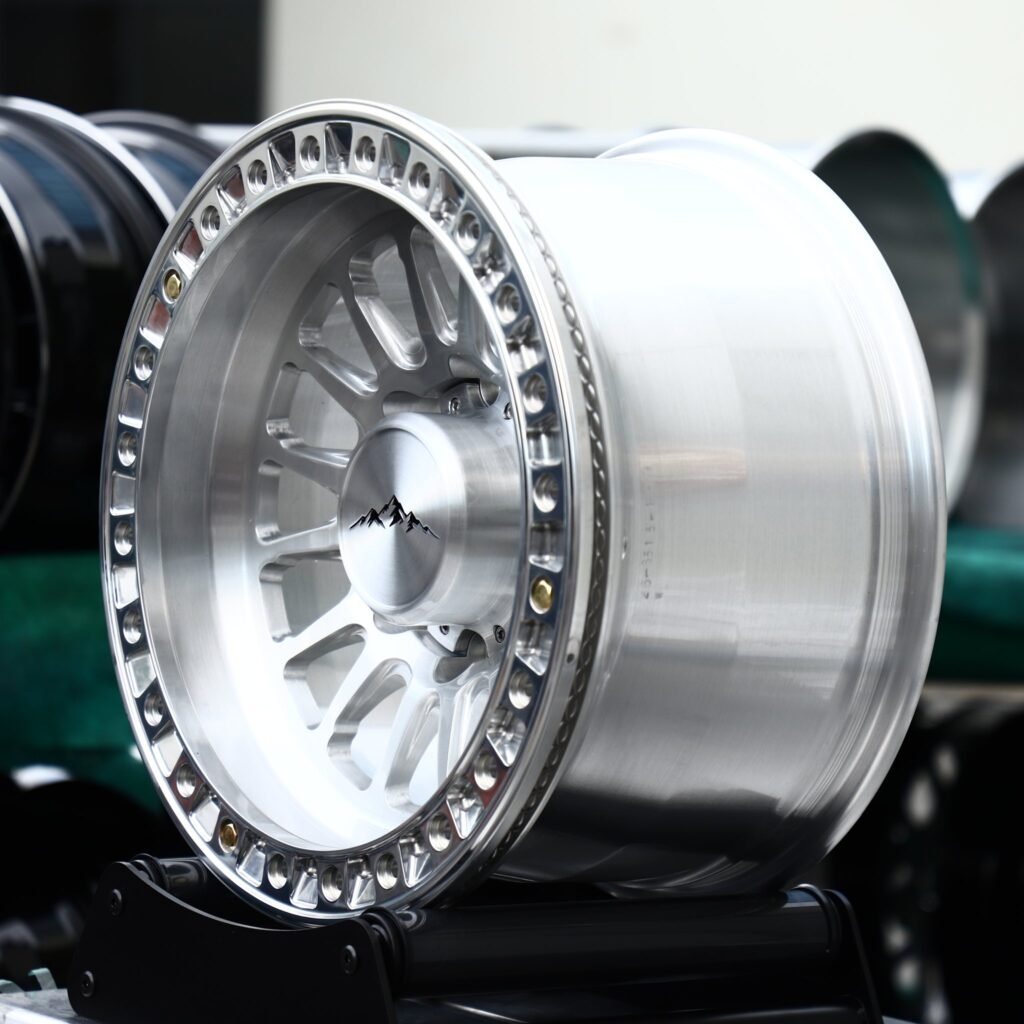 8x165.1 wheels – Polished 18-Spoke Bolted Ring Mountain Cap, side view