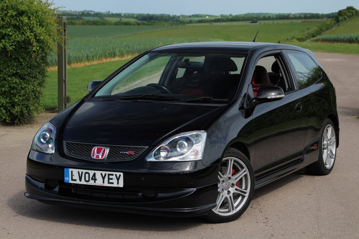 Black 2004 Honda Civic Type R EP3 hatchback on 17-inch silver multi-spoke wheels