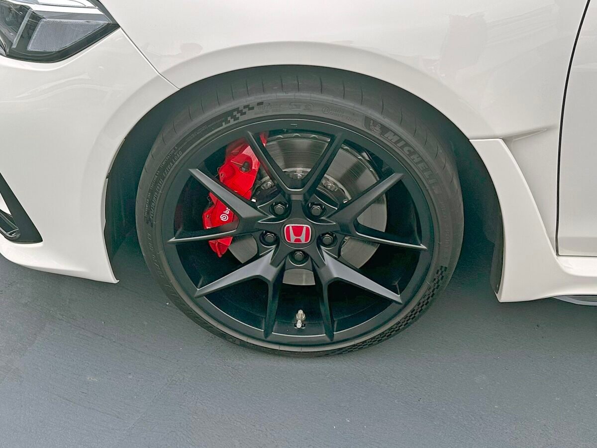 Civic Type R wheel specs on the FL5: factory 19-inch matte black wheel with Michelin tire and red Brembo caliper