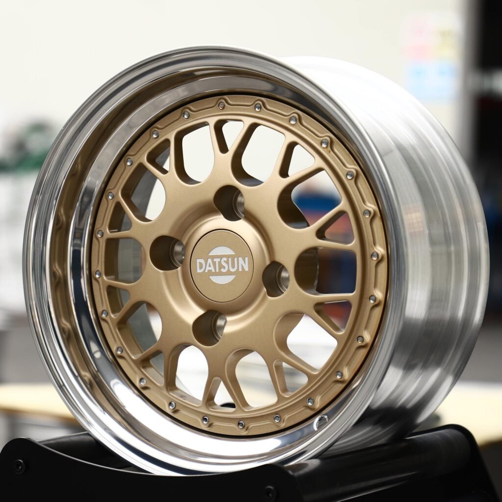 Datsun mi-DO wheels – Gold Cross-Spoke Mesh 2-Piece Polished Lip (Datsun OEM-Style), angled view
